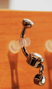 Close-up of implant-grade ASTM F136 titanium body jewelry polished to mirror finish for safe piercing